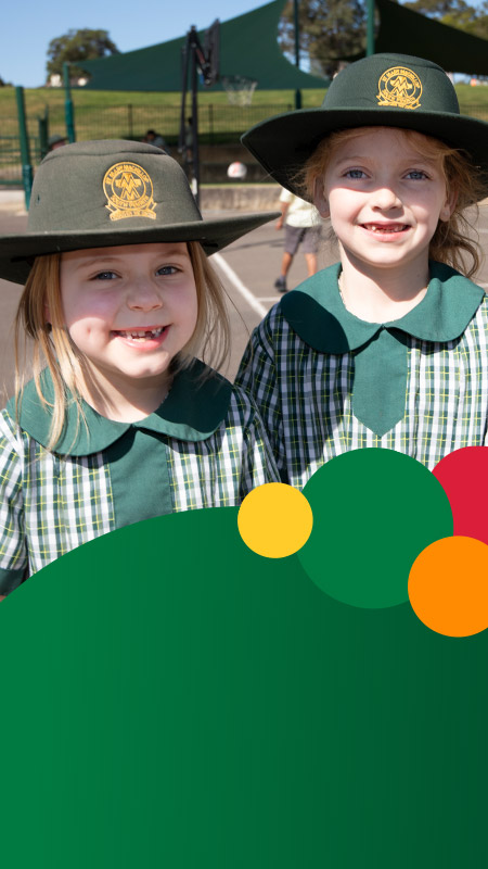 Students smiling together in the playground at St Mary MacKillop Primary School South Penrith