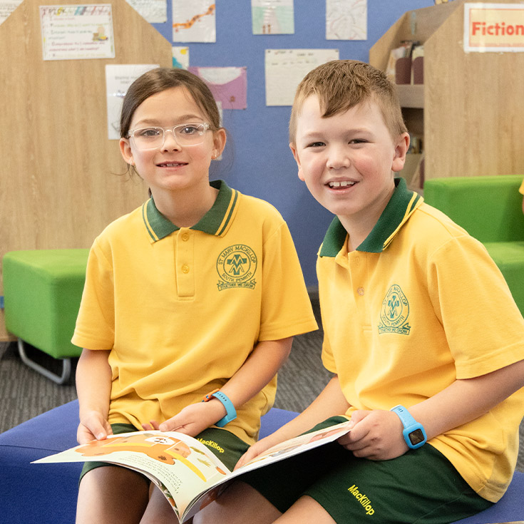 Students reading together in the library at St Mary MacKillop Primary School South Penrith
