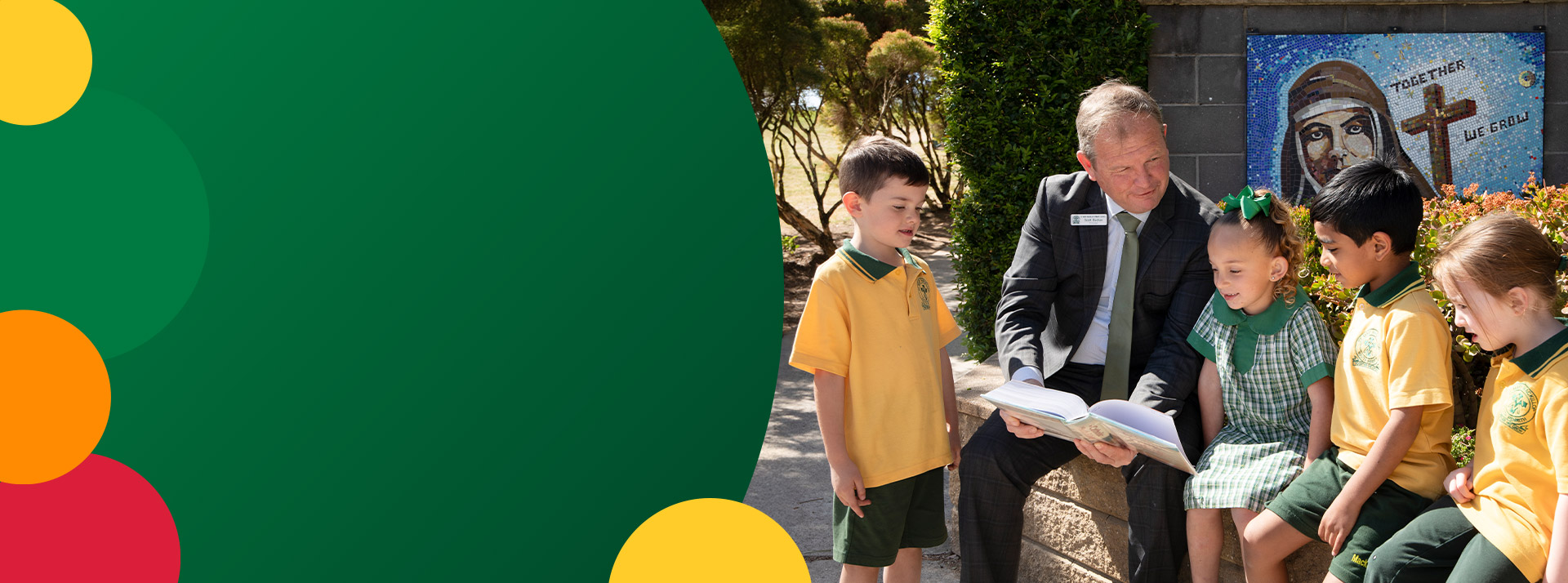 Principal of St Mary MacKillop Primary School South Penrith with his students on the school groundsScott Buchan