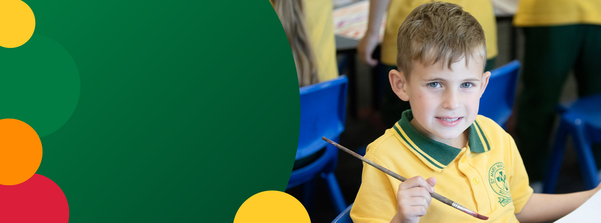 Student painting in the classroom at St Mary MacKillop Primary School South Penrith