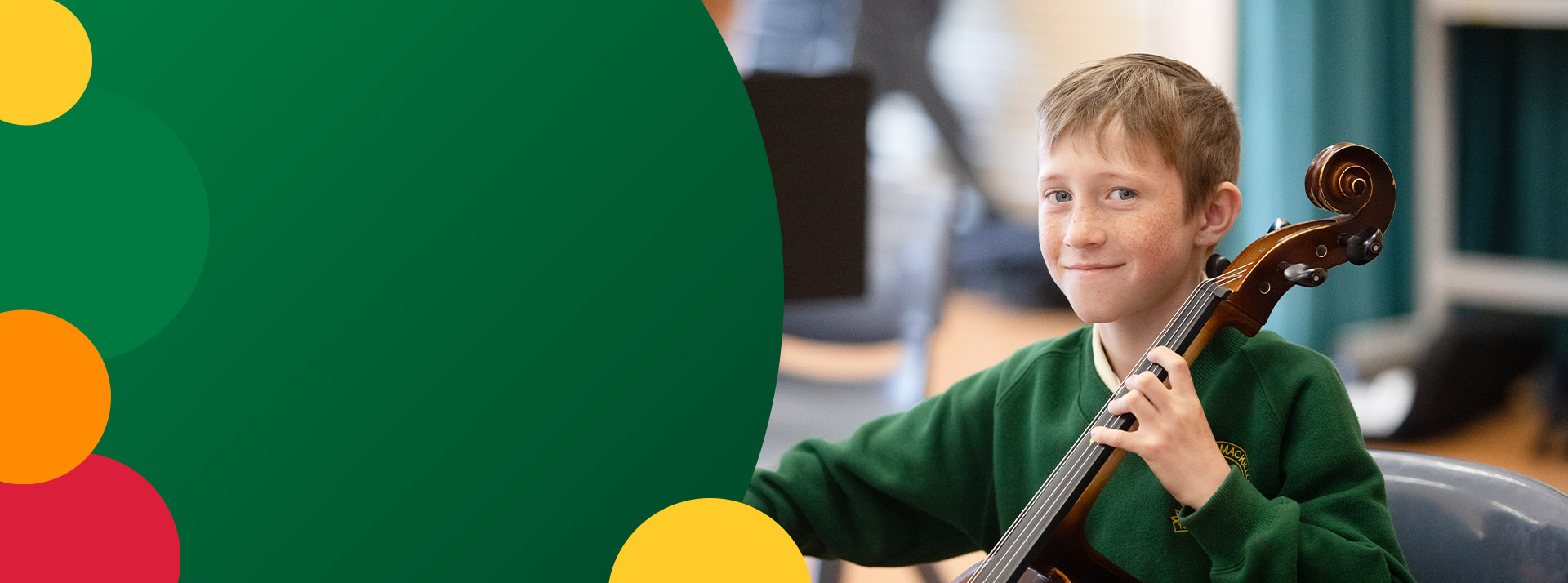 Student playing a cello in the classroom at St Mary MacKillop Primary School South Penrith
