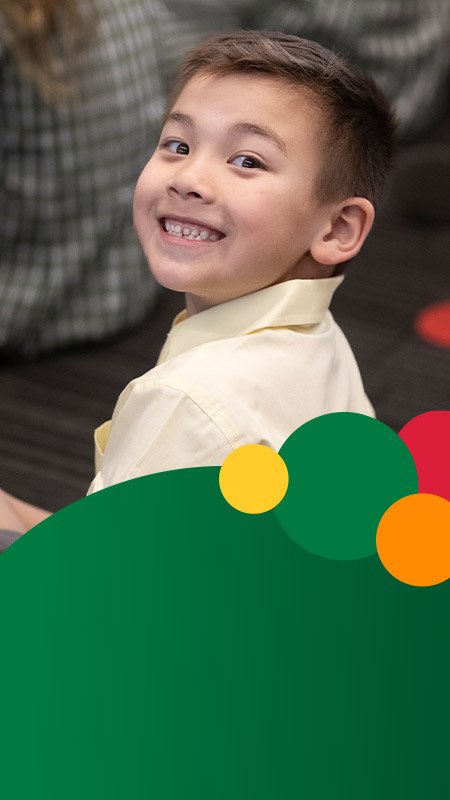 Student smiling in the classroom at St Mary MacKillop Primary School South Penrith