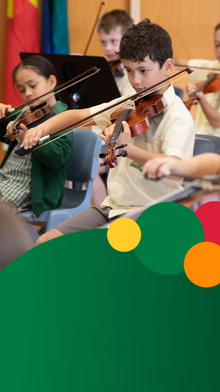 Students playing the violin at St Mary MacKillop Primary School South Penrith