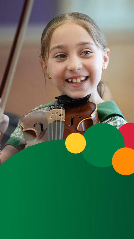 Student playing the violin at St Mary MacKillop Primary School South Penrith