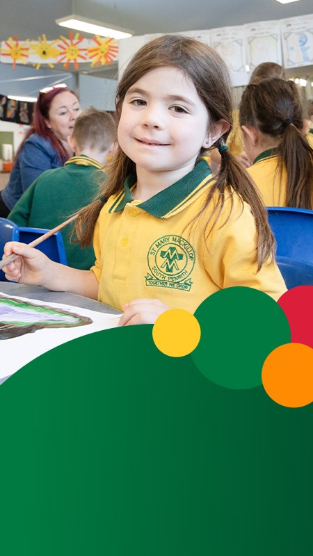 Student painting in the classroom at St Mary MacKillop Primary School South Penrith