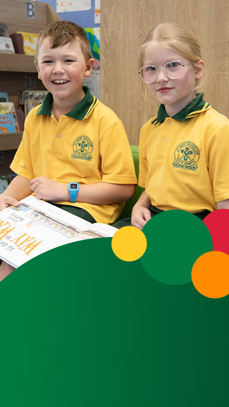Students reading together in the library at St Mary MacKillop Primary School South Penrith
