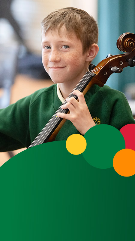 Student learning to play the cello in the classroom at St Mary MacKillop Primary School South Penrith