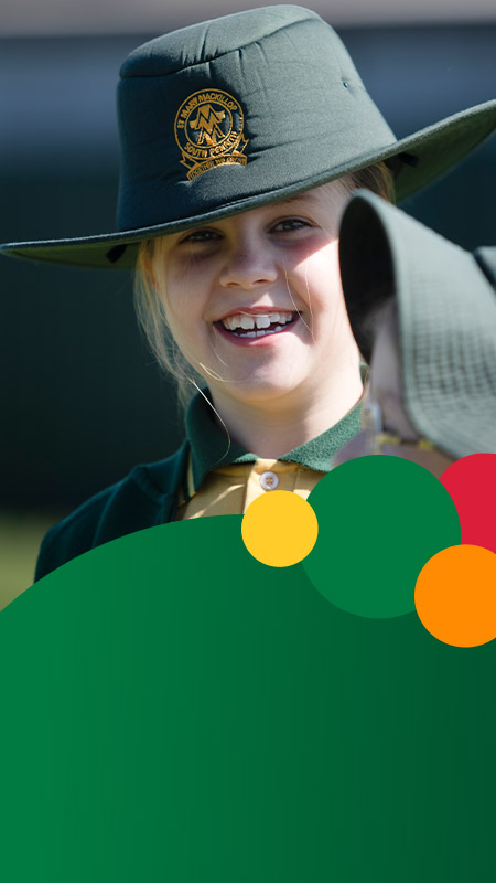 Student smiling in the playground at St Mary MacKillop Primary School South Penrith
