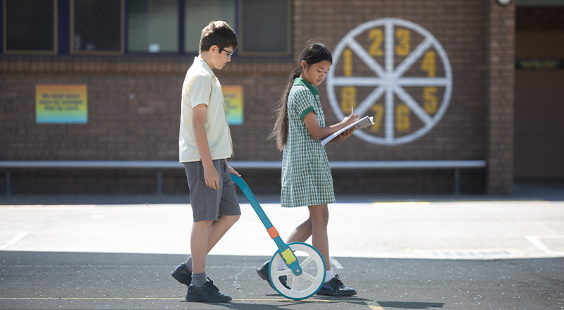 Students learning numeracy in the playground at St Mary MacKillop Primary School South Penrith