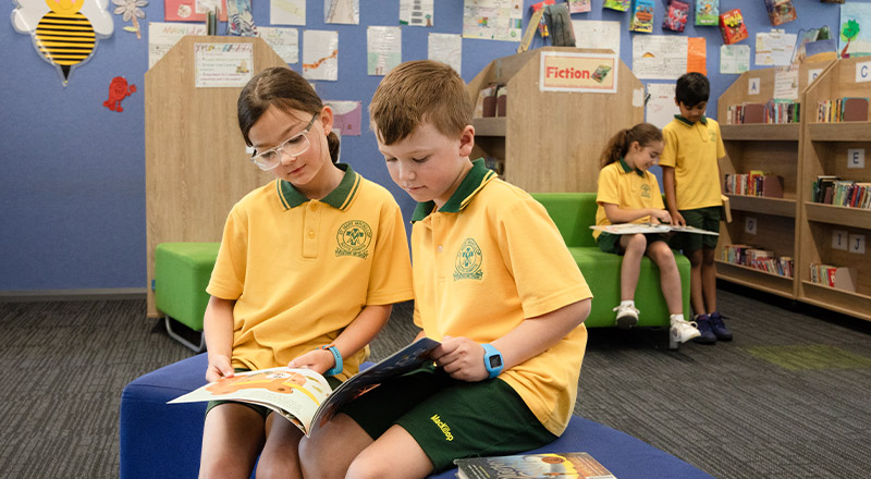 Students reading in the library at St Mary MacKillop Primary School South Penrith