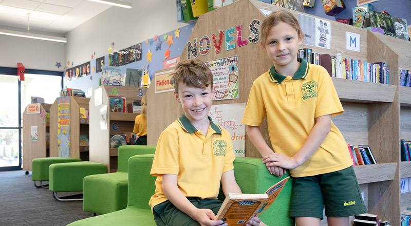 Students reading together in the library at St Mary MacKillop Primary School South Penrith
