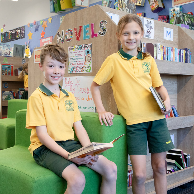 Students reading together in the library at St Mary MacKillop Primary School South Penrith
