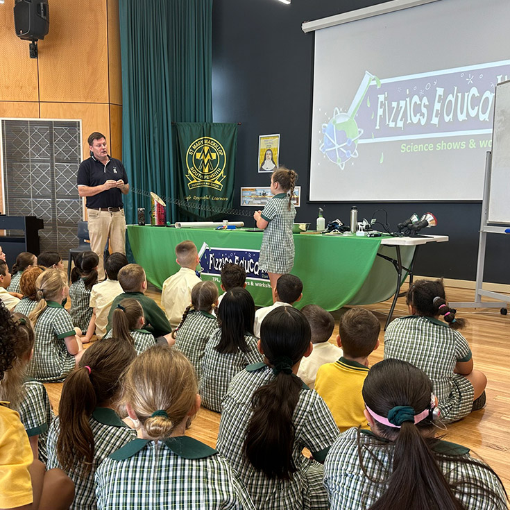 Students at a science incursion in the hall at St Mary MacKillop Primary School South Penrith