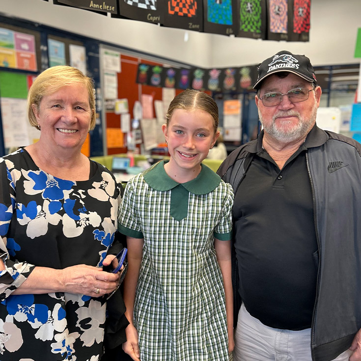 Student with her grandparents in the classroom at St Mary MacKillop Primary School South Penrith
