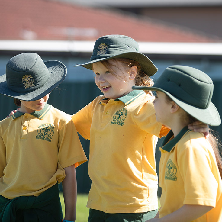 Students playing together outside at St Mary MacKillop Primary School South Penrith