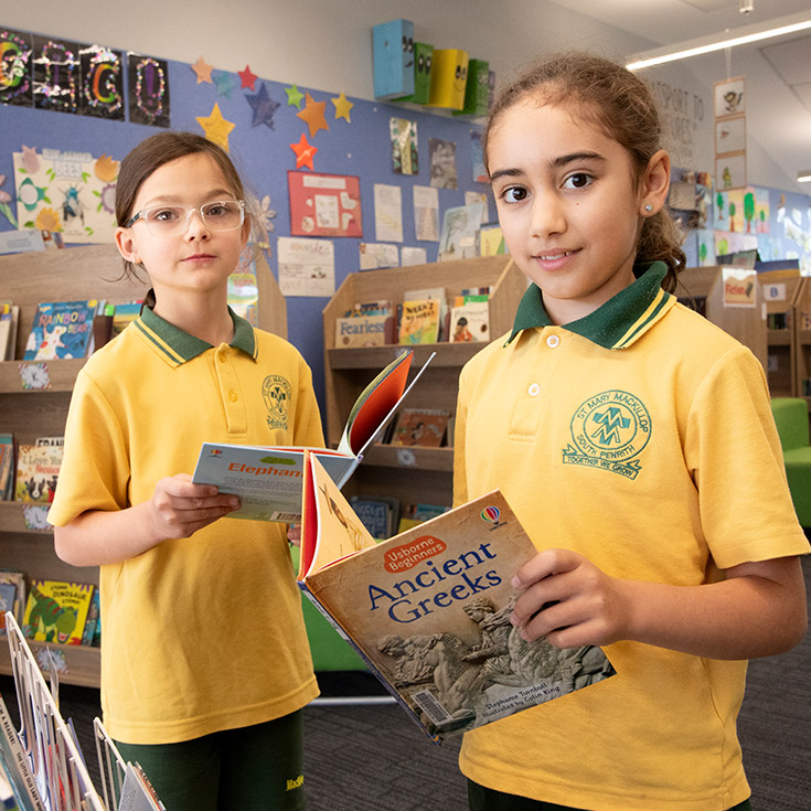 Students reading in the library together at St Mary MacKillop Primary School South Penrith